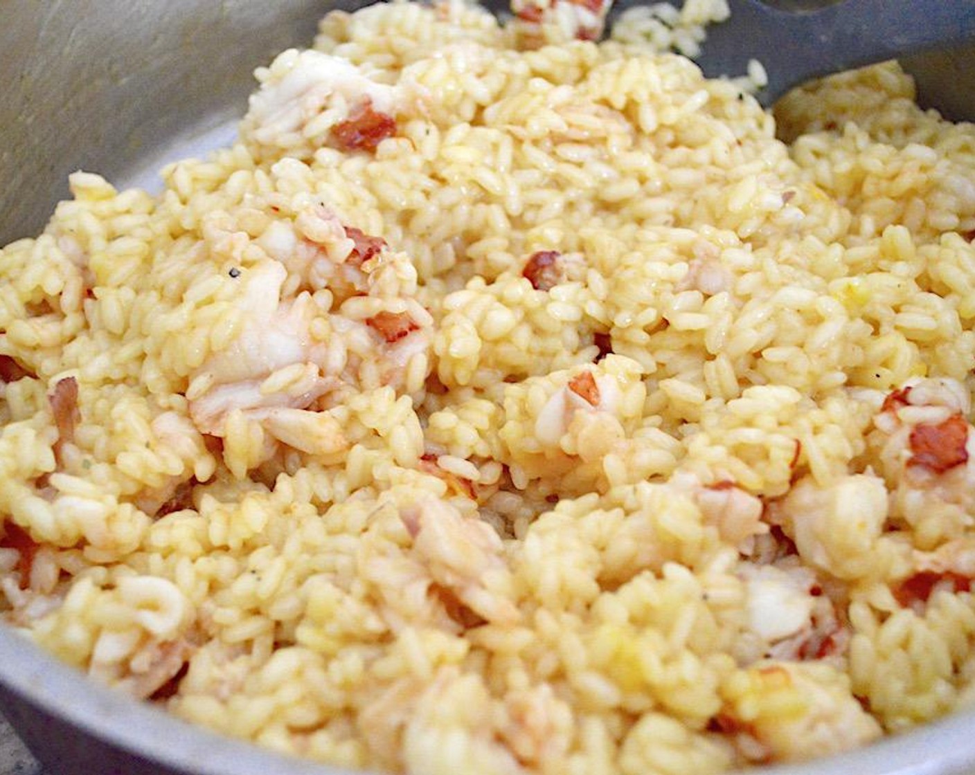 step 7 Repeat this 3 more times until the chicken stock is gone and is completely absorbed in the rice. Then add the lobster back in and stir it all well. Take the pan off of the heat and stir in the Asiago Cheese (2 Tbsp) until it is melted.