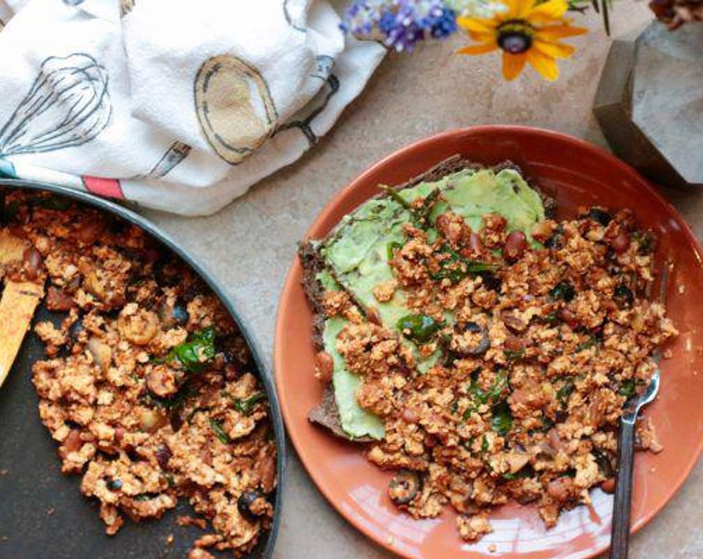 step 6 Serve with 2 pieces of toast evenly spread and smash the Avocado (1/2) and Vegan Cream Cheese (2 Tbsp).