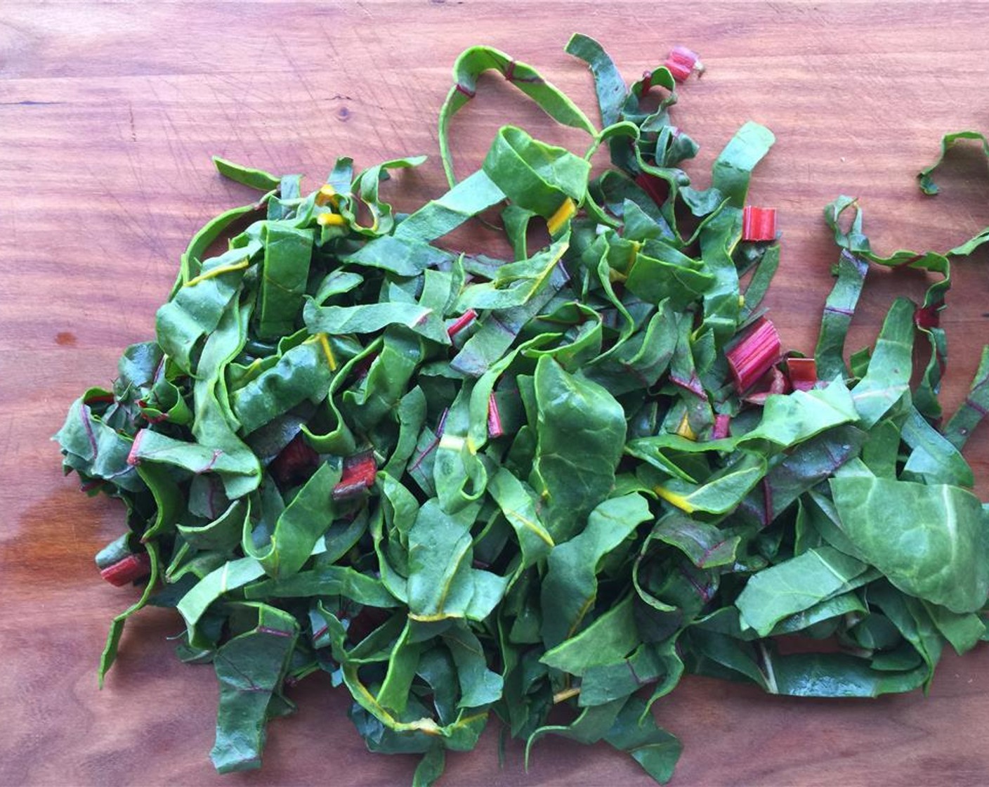 step 10 Finely chop the stem and leaves of the baby rainbow chard. Set aside.