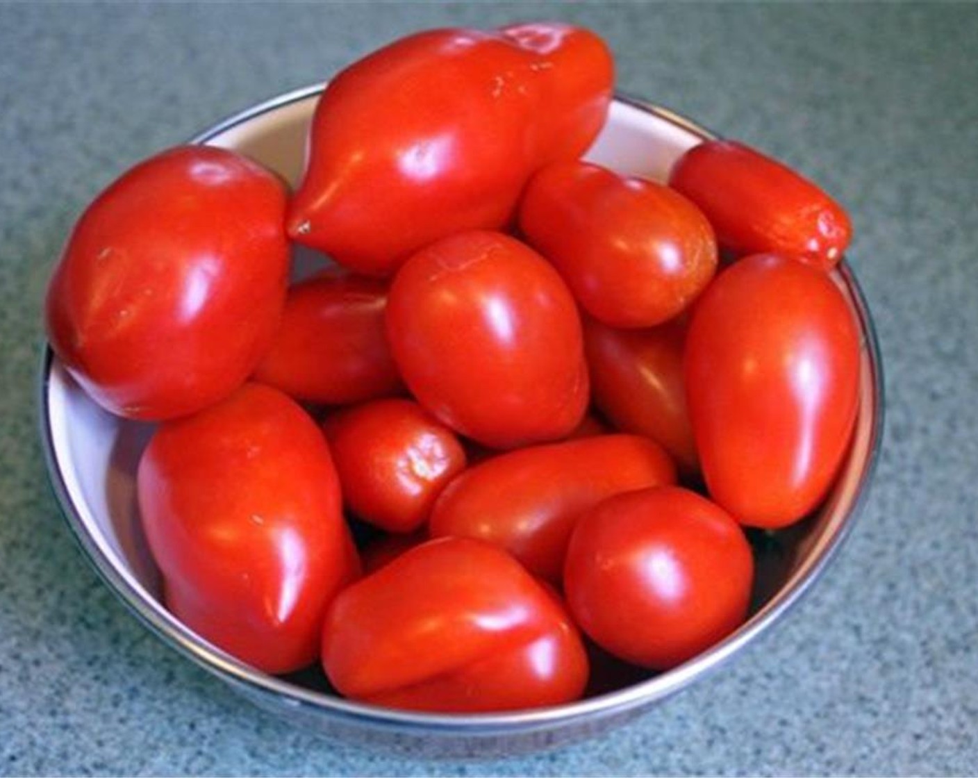step 1 Bring a large pot of water to a boil. Meanwhile clean and rinse the Tomatoes (10 cups). Prepare an ice bath.