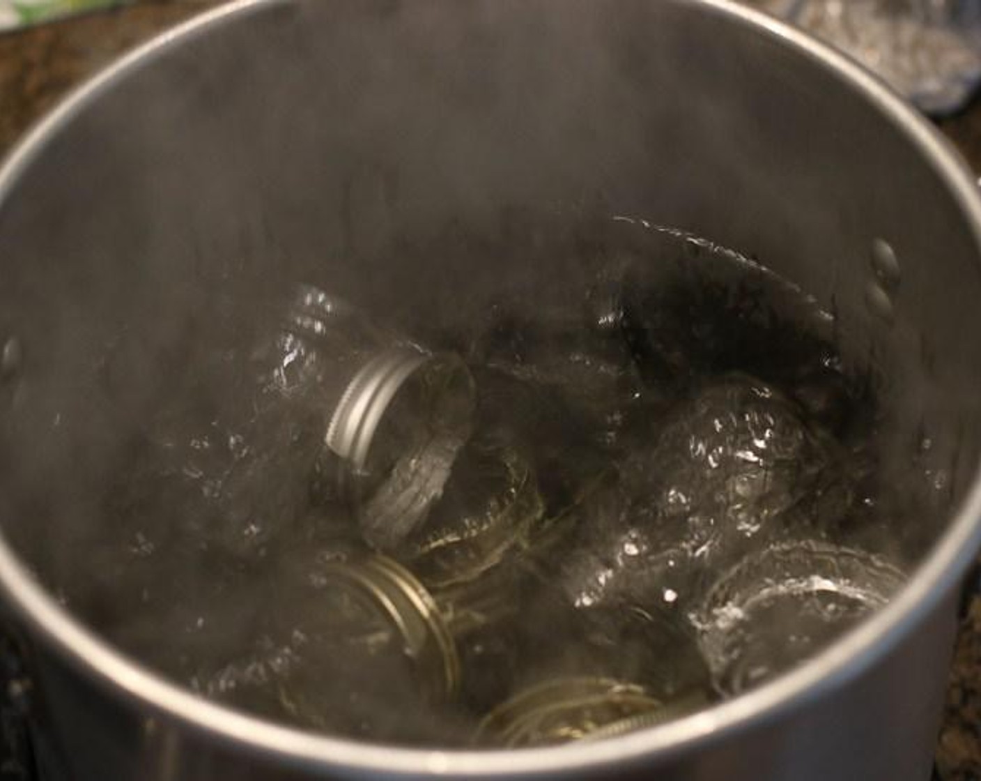 step 1 Sterilize clean ball canning jars and tight fitting lids in boiling water.