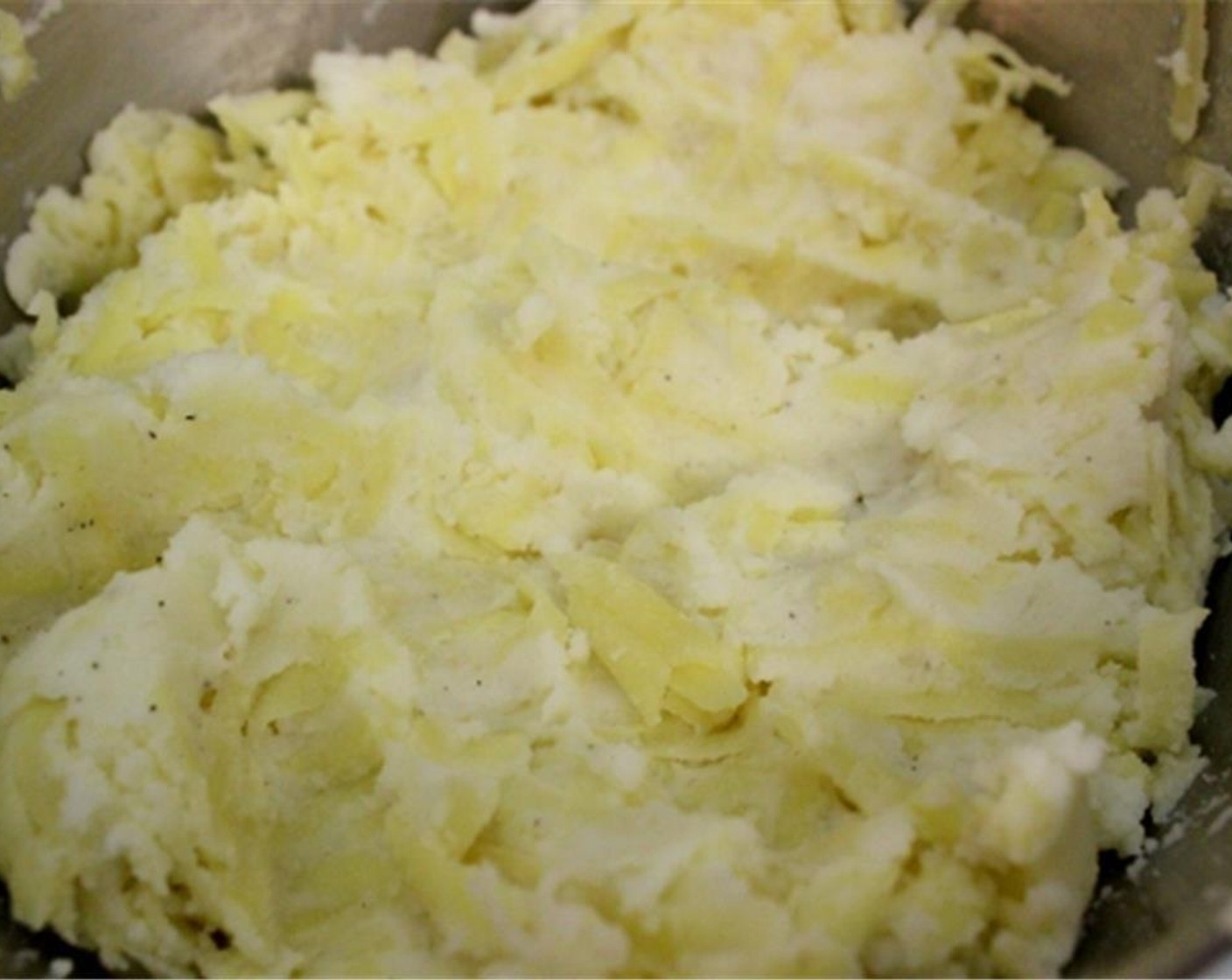 step 2 Combine the grated potatoes with Mashed Potatoes (2 1/2 cups). Season with Salt (1 tsp) and Ground Black Pepper (1/2 tsp). Set aside.