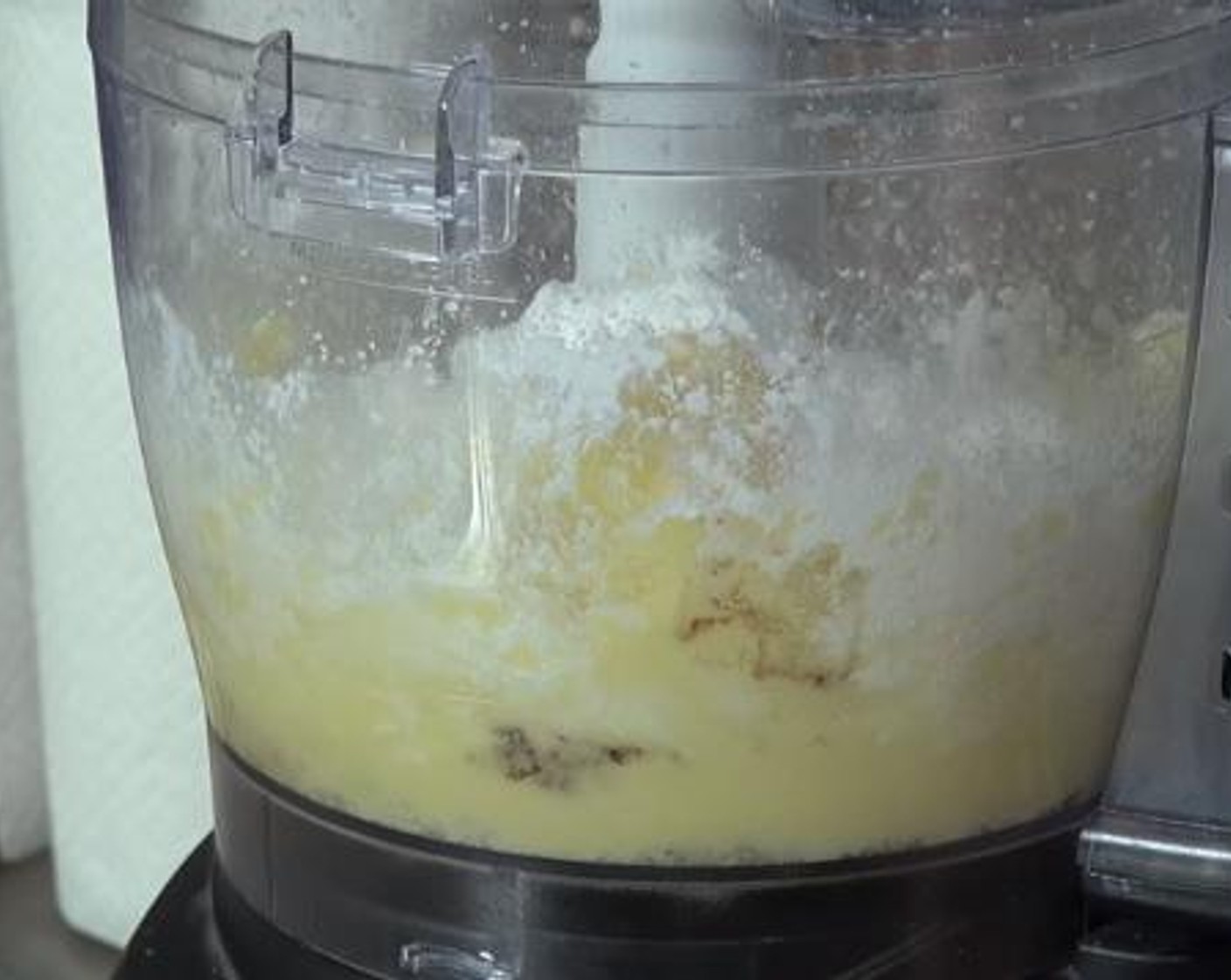 step 2 Into a food processor, add the Butter (4.5 oz) and Caster Sugar (1/2 cup). Process until it is nice and creamy.