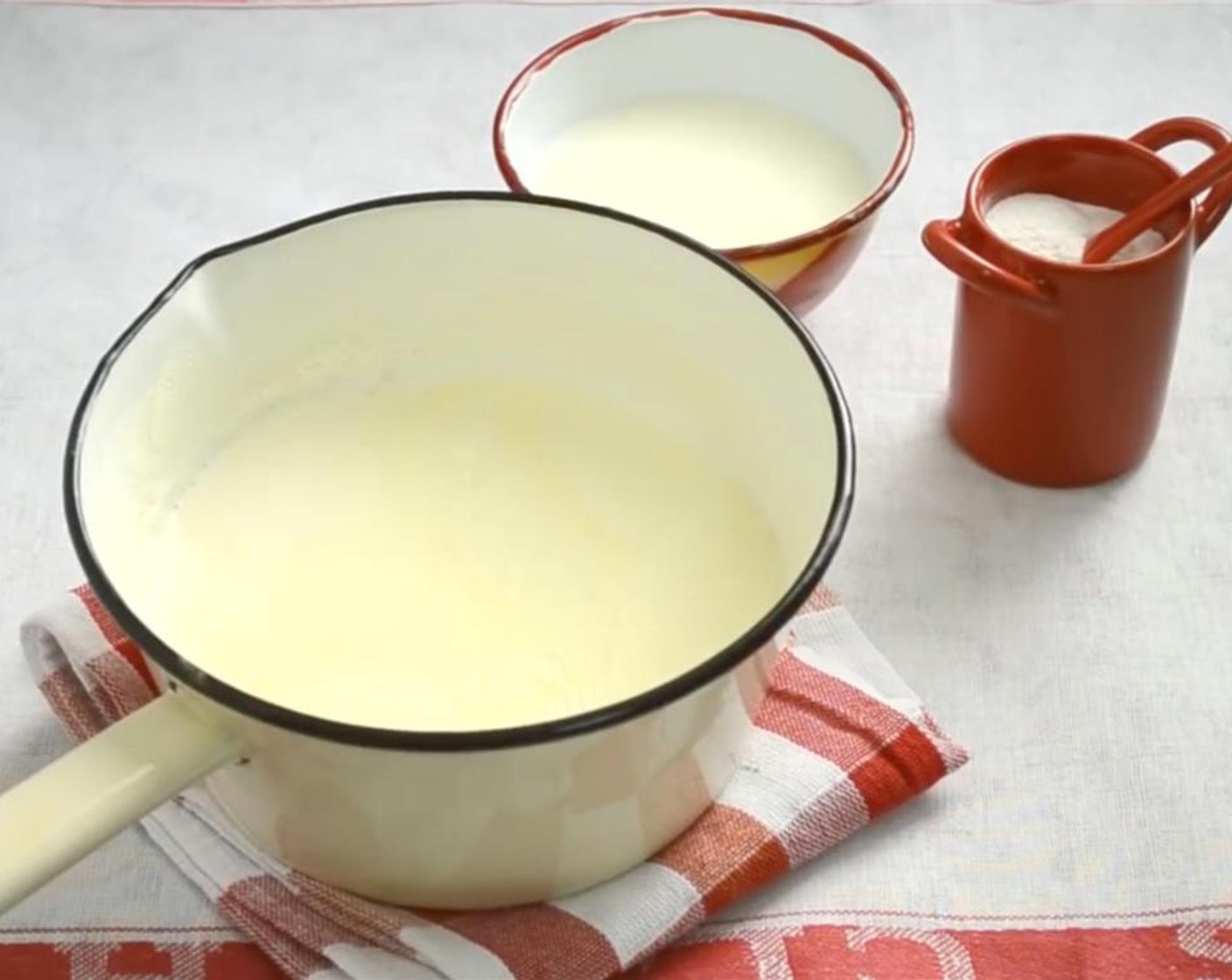 step 5 Dissolve the Rice Flour (4 Tbsp) in the remaining cup of milk. Add to the hot milk and stir. Then, return the pot to the heat.