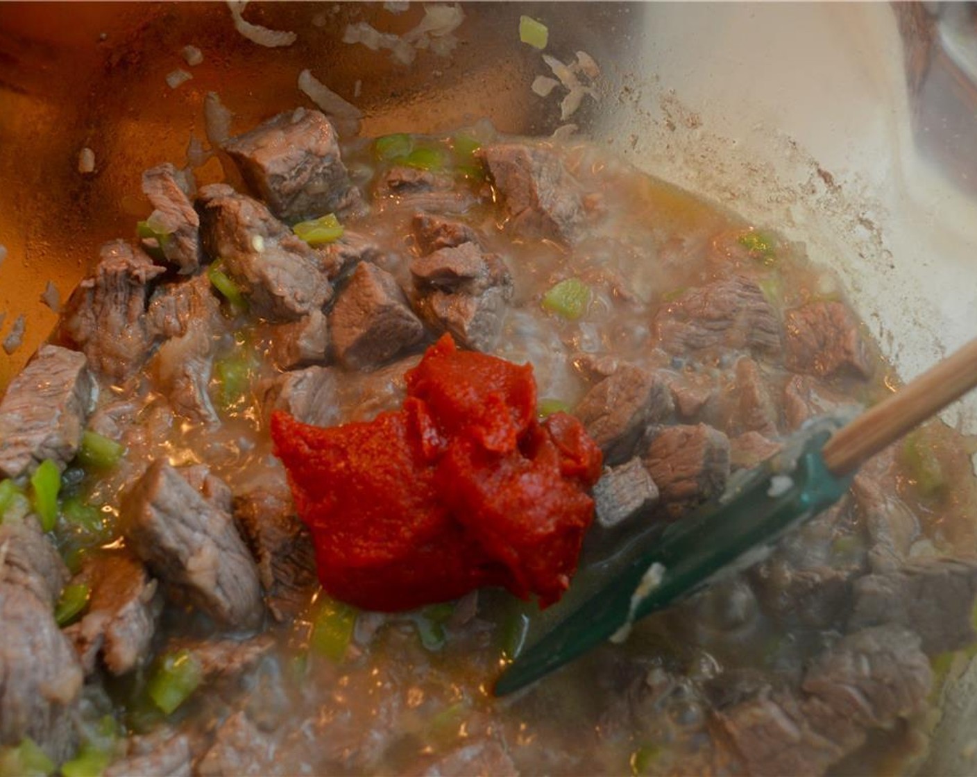 step 5 Add Tomato Paste (1/4 cup) and cook for 1 minute, stirring, until the tomato paste fragrance is strong.