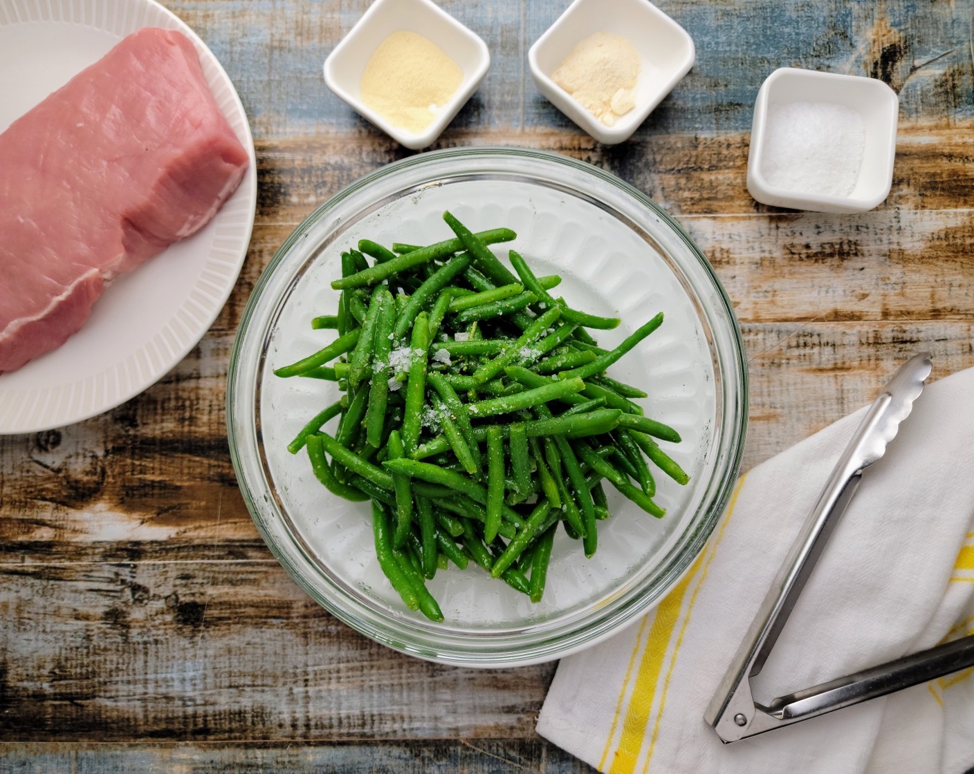 step 3 While the sweet potatoes are cooking, in a medium bowl toss the Green Beans (6 cups) with Olive Oil (1 Tbsp), Simply Organic Garlic Powder (1 tsp), Simply Organic Onion Powder (1 tsp), Kosher Salt (2 tsp), and Ground Black Pepper (1 tsp).
