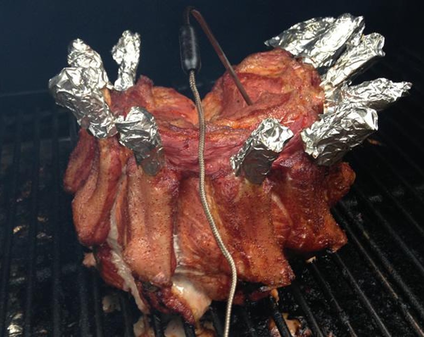 step 4 For a Smoked Crown Roast of Pork, run the pit at 275 degrees F (140 degrees C) with apple BBQr’s Delight pellets for 2 hours. Center the crown roast on the cooking grate and insert a Thermoworks Chef Alarm Probe into the middle of the loin set for 140 degrees F (60 degrees C). When inserting the probe be sure not to hit bone or you’ll get false readings as it cooks.