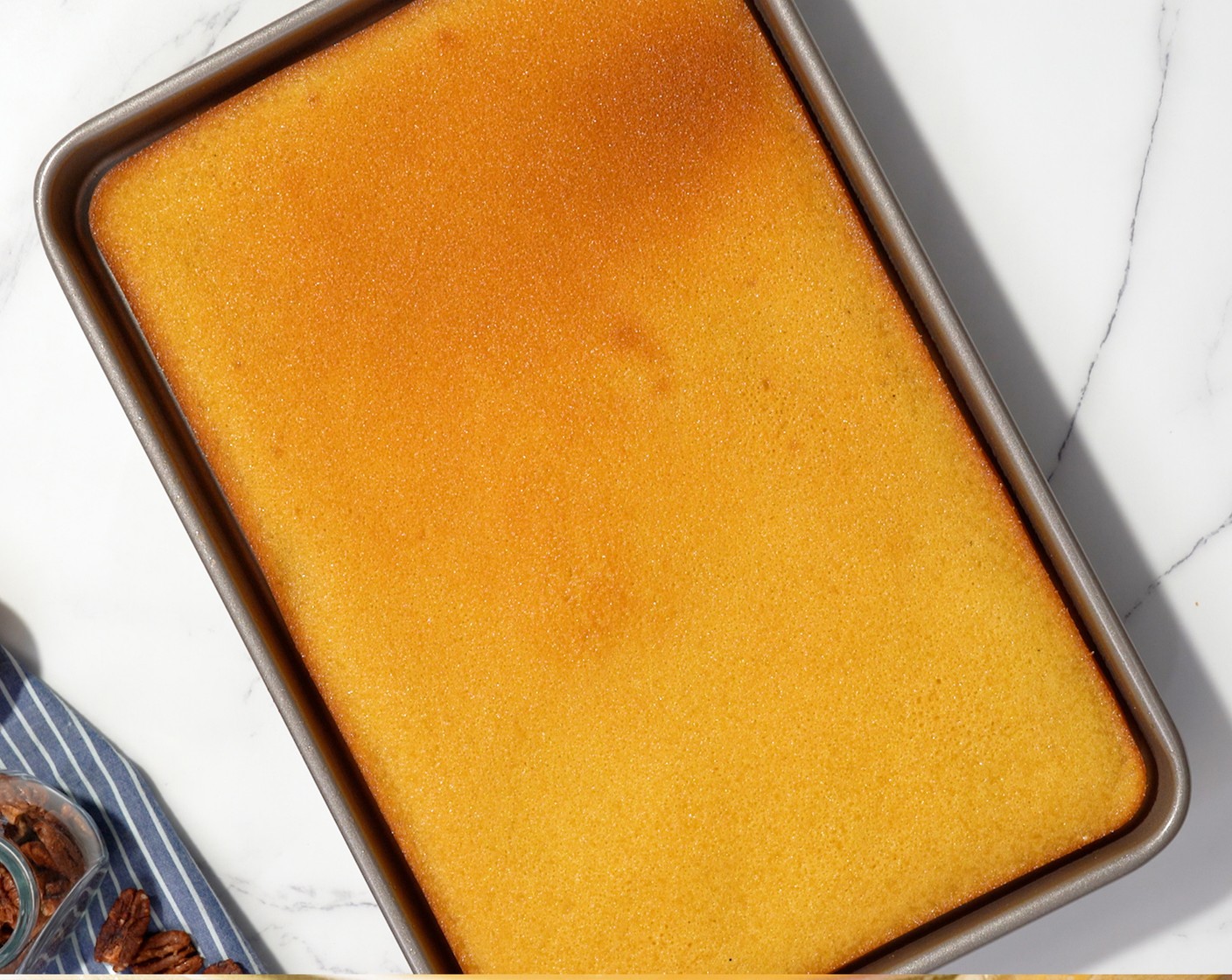 step 7 Pour the batter into a greased baking pan. Bake until golden brown and the toothpick inserted in the center comes out clean, about 20 minutes.