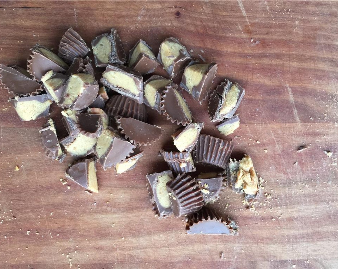 step 4 Unwrap the Reese's Peanut Butter Cups (8) and chop in half and thirds, so no two pieces look the same.