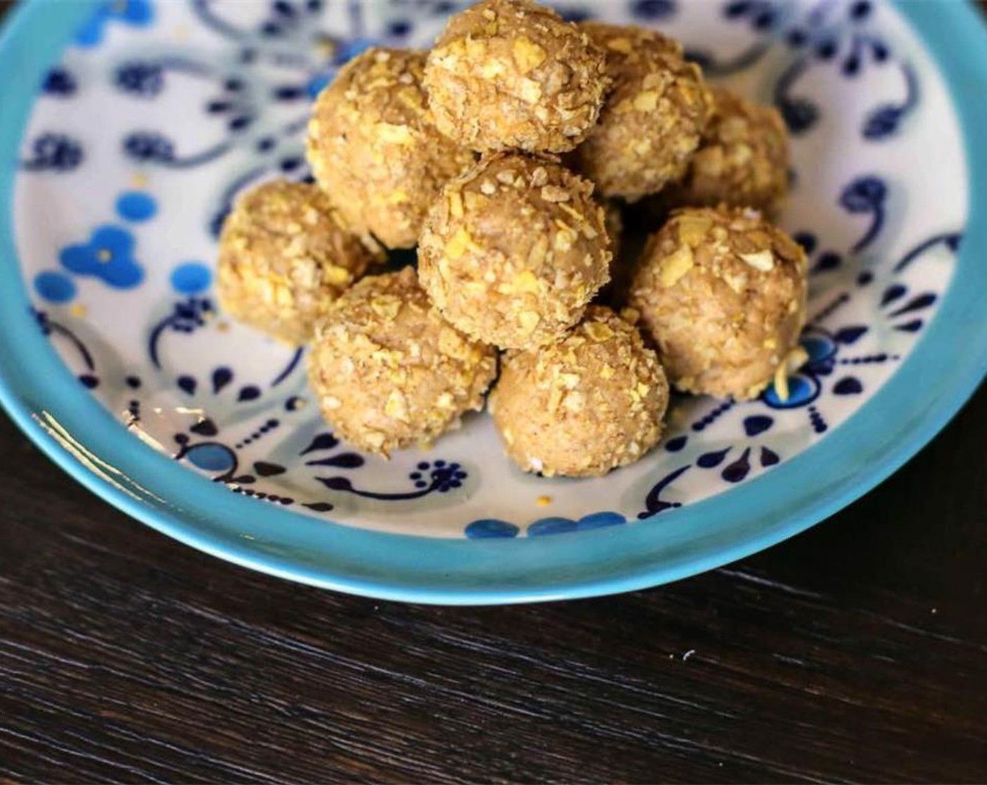 step 4 Take bowl out of fridge and scoop out 1 tablespoon worth of mixture. Place a Dark Chocolate Chips (1 pckg) in the middle of the mixture and roll into a ball shape. Cover the ball in crushed oats. Place in Ziplock bag. Store in the fridge until needed. Serve and enjoy!