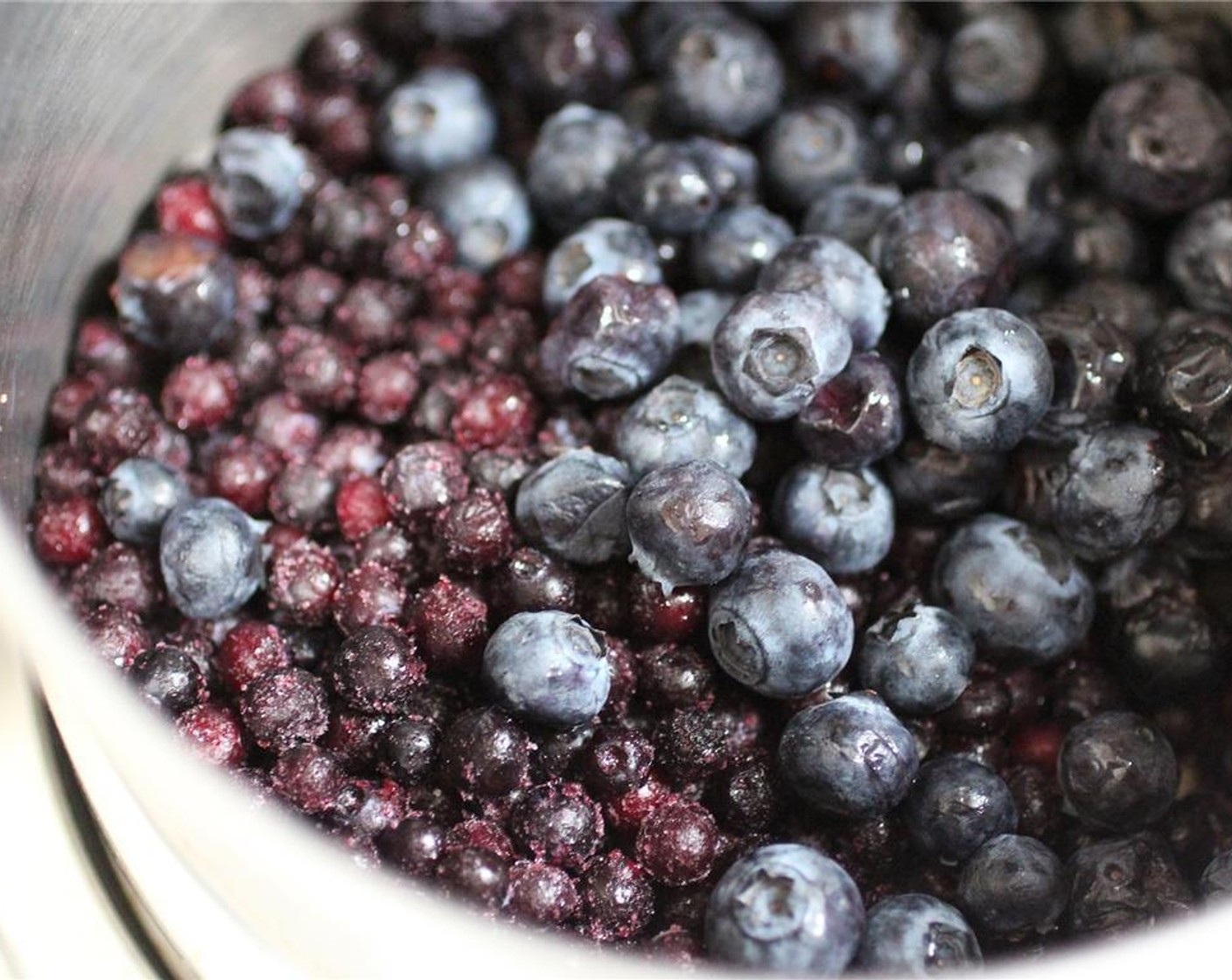 step 1 Place the Fresh Blueberries (2 cups) in a pot over high heat, and bring to a boil. Turn down to a simmer, and stir.