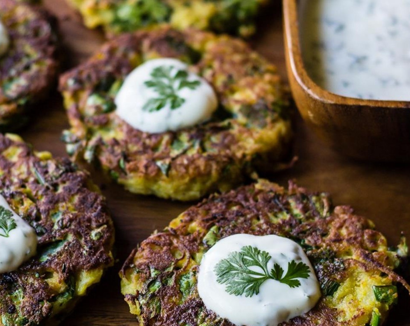 step 11 Once all of the fritters are done, top them off with yogurt sauce, garnish with Fresh Cilantro (to taste) and serve. Enjoy!