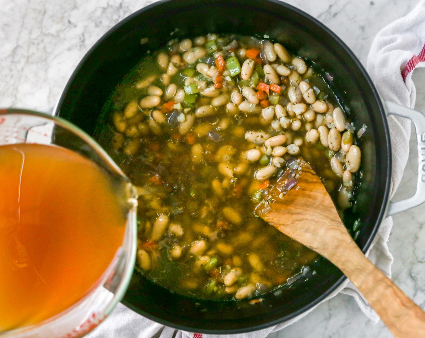 step 5 Pour in the Vegetable Broth (4 cups) and stir again.