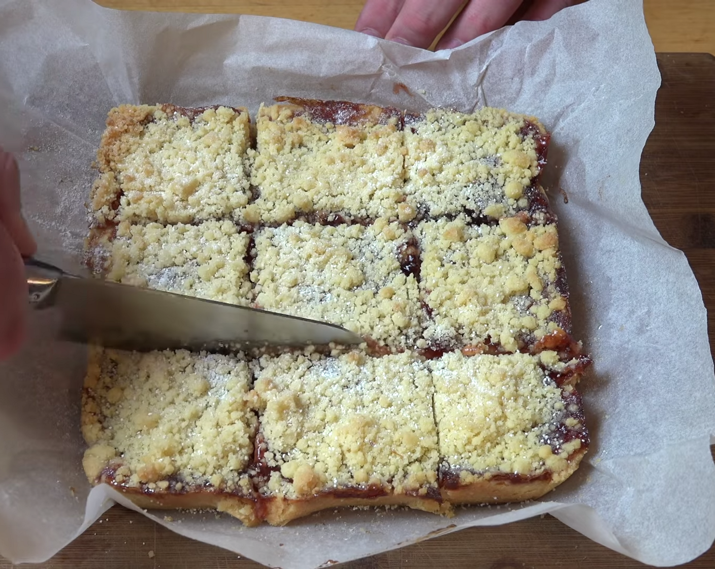 step 13 Once cooled, dust the top with Powdered Confectioners Sugar (2 Tbsp). Using a sharp knife cut the shortbread into squares.