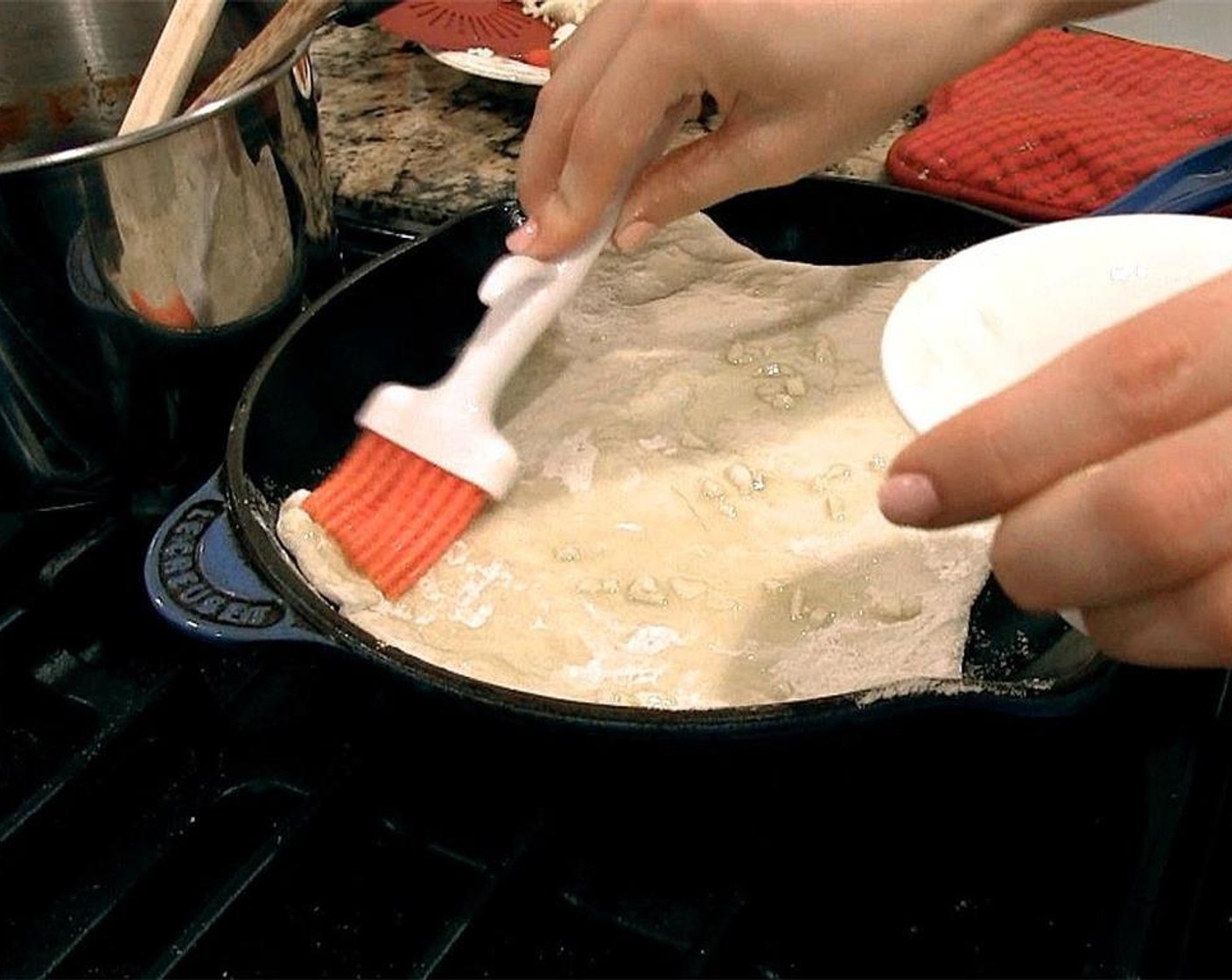 step 11 Mix the remaining olive oil and minced garlic in a ramekin. Brush onto the pizza dough.