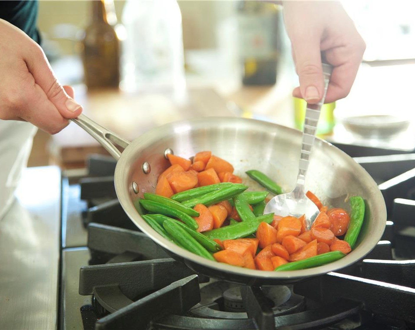 step 11 Heat the same small saute pan over medium heat with Olive Oil (1 Tbsp). When oil is hot, add carrots and snap peas to pan and stir until vegetables are cooked, about four minutes.