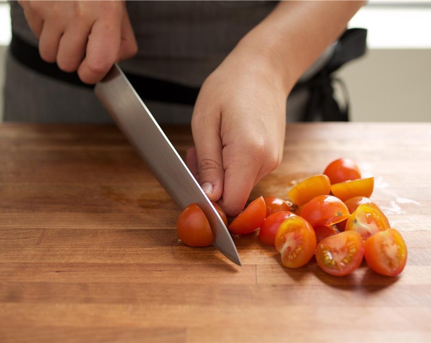 step 2 Finely chop Garlic (1 clove) and set aside. Slice the Cherry Tomato (1 cup) in half, and set aside. Slice the Extra Firm Tofu (1 pckg) lengthwise into four equal sized quarter inch thick slices.