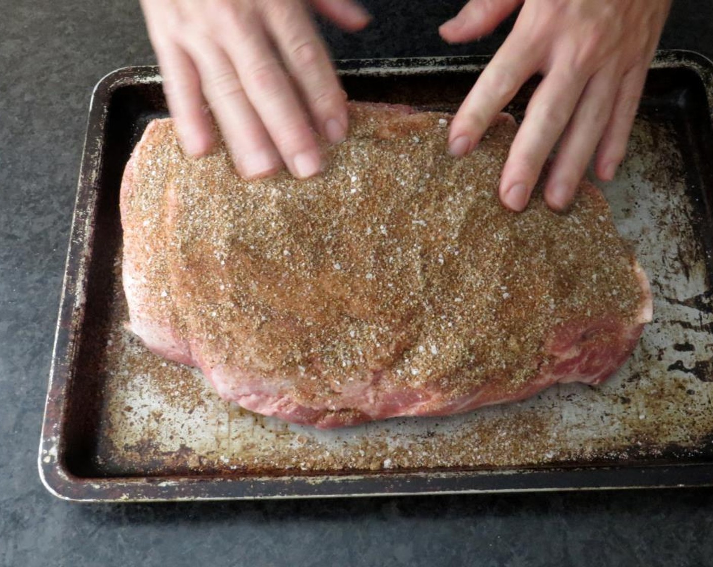 step 3 Sprinkle the Pork Shoulder (5 lb) liberally on all sides with rub, pat and rub it in with your fingers. Place on a rimmed baking sheet and cover with plastic wrap. Refrigerate overnight. Soak 4 cups of hickory wood chips in water.