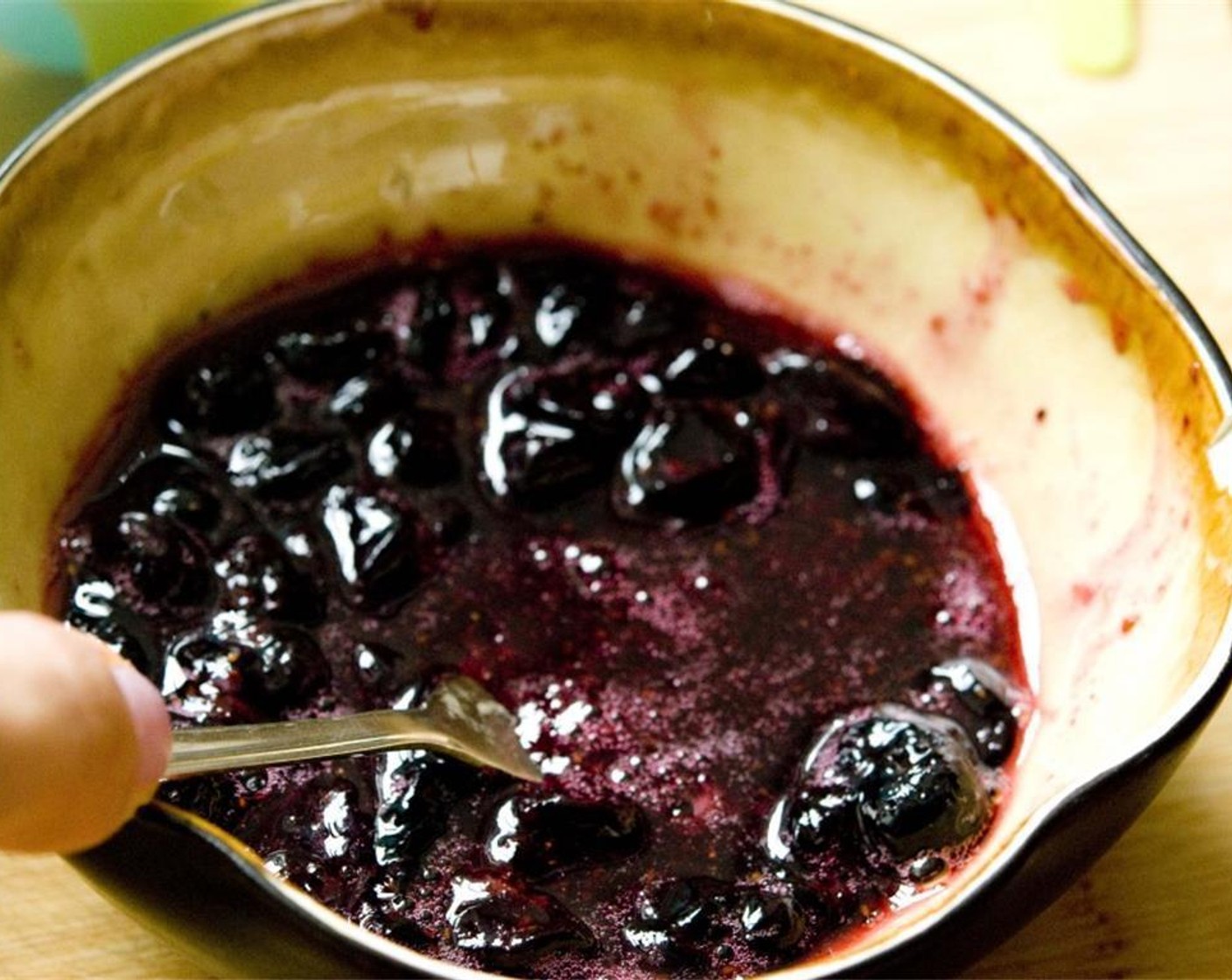 step 2 With a fork, mash a few of them while you mix the blueberries with the honey.
