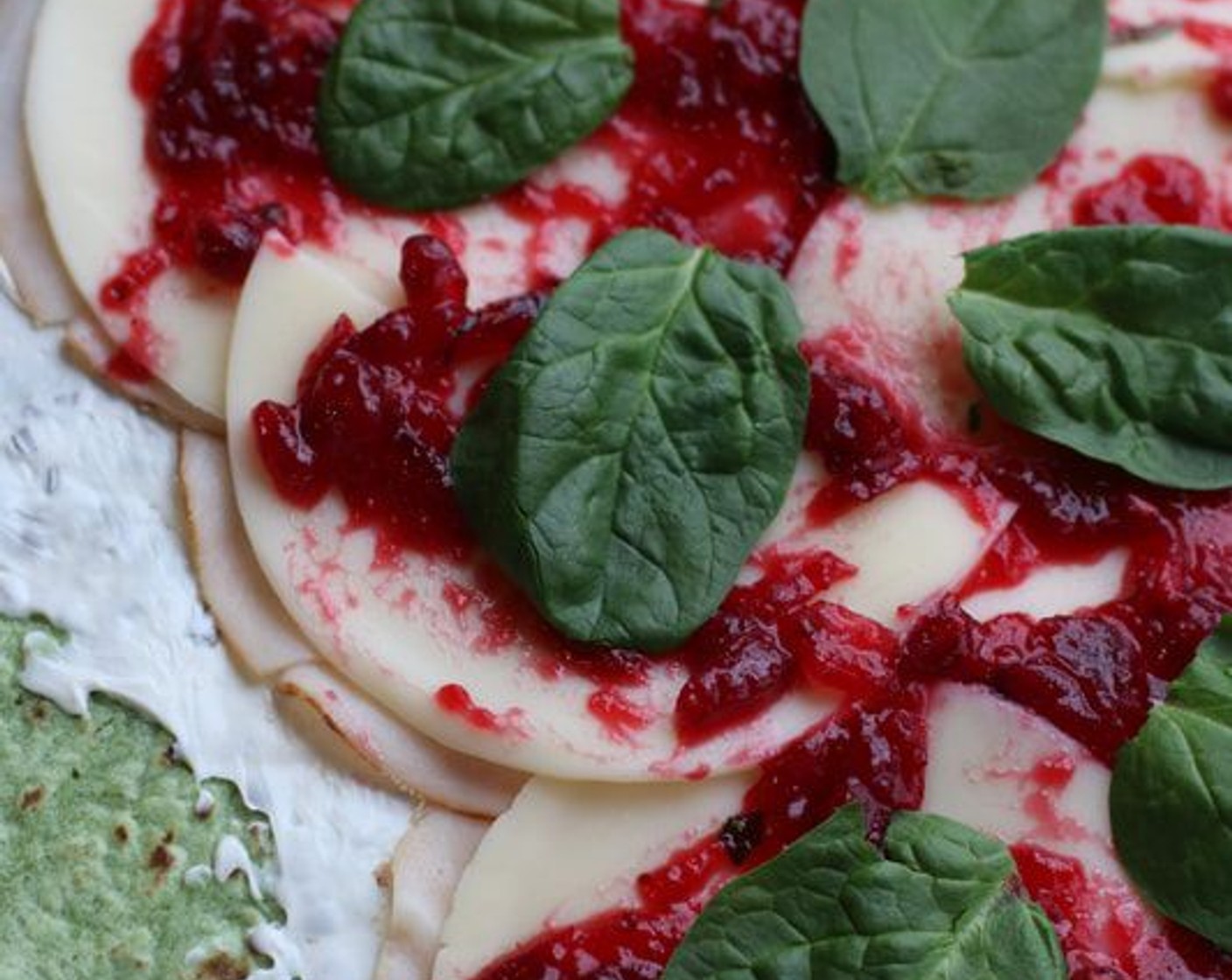 step 5 Layer Spinach Leaves (to taste) on top of the cranberry sauce.