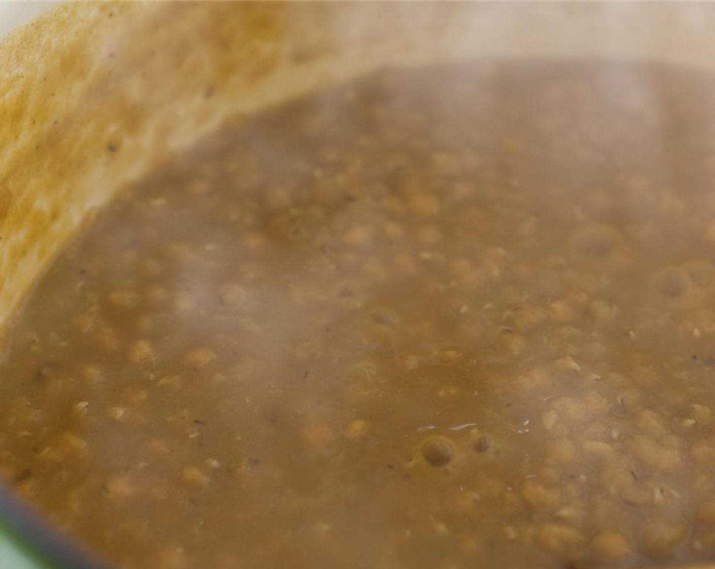 step 5 Continue to saute for another few minutes, then remove from heat. Add Coconut Milk (1 can) as well as cooked onions to the lentil mixture and stir.