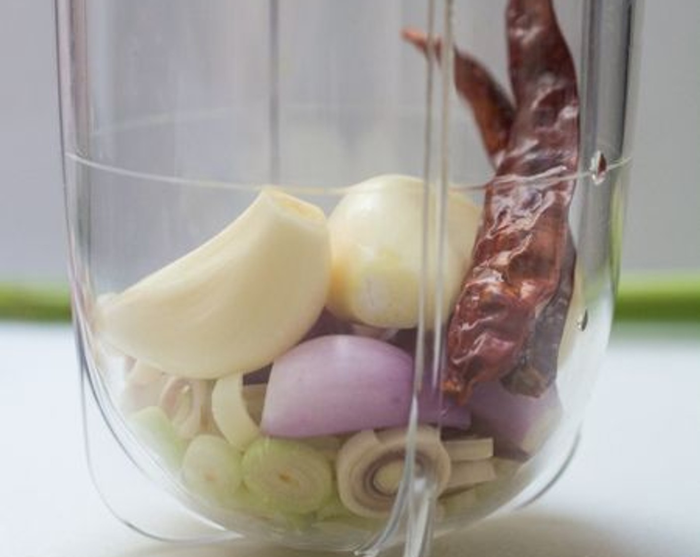 step 5 Put the sliced lemongrass, Garlic (3 cloves), Shallots (4), Ground Cumin (2 tsp) and Ground Coriander (1 Tbsp) into the blender.