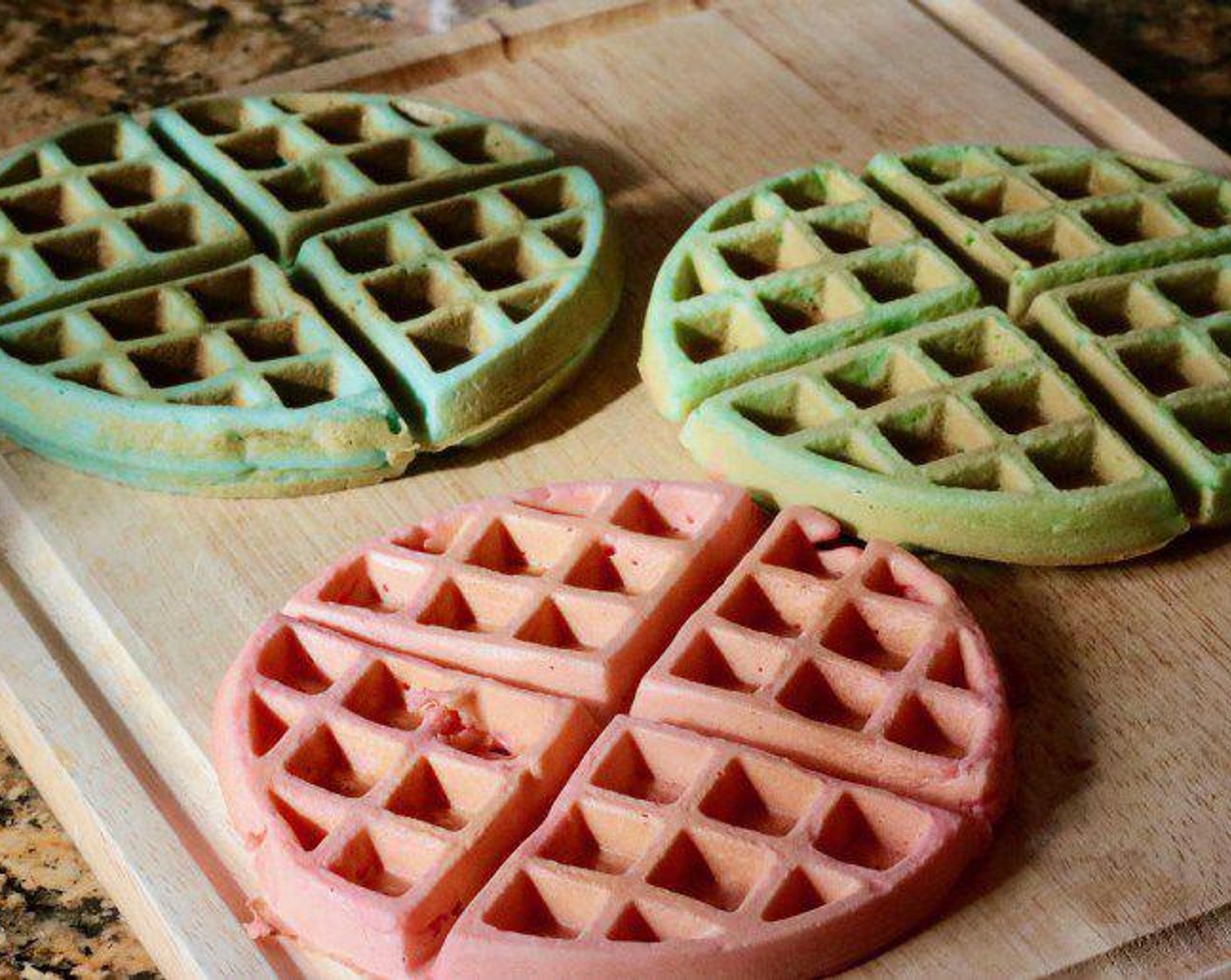 step 2 Using three bowls, divide the waffle mix evenly into each bowl and dye each bowl your preferred Food Coloring (to taste). Cook waffles.