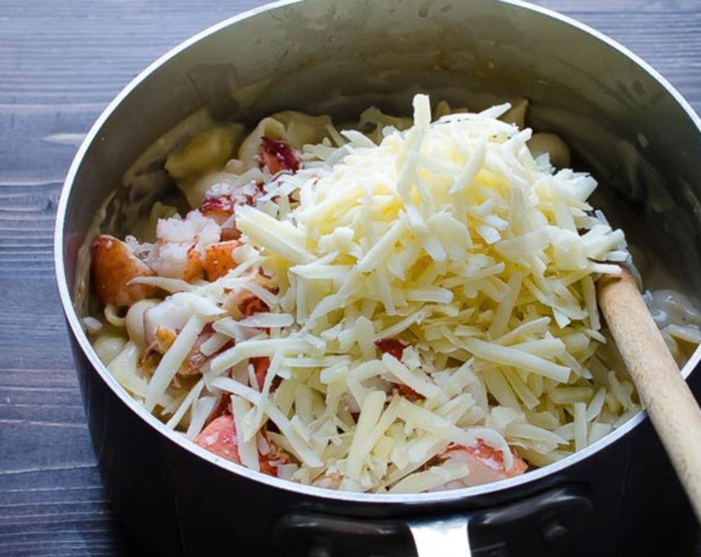 step 5 Remove the sauce from heat and stir in the pasta. Add the Lobster Chunks (1 1/2 cups), Gruyère Cheese (1 3/4 cups) and Fresh Parsley (1 Tbsp). Stir to combine.