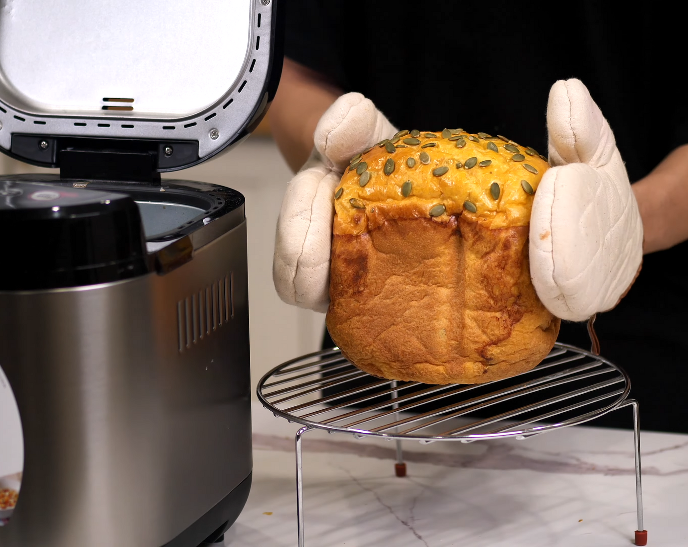 step 9 Let the machine run its thing until it finishes the setting. Once baked, remove the bread from the tin immediately and let it cool on a wire rack while you brush some melted butter over the top for a nice shiny finish.