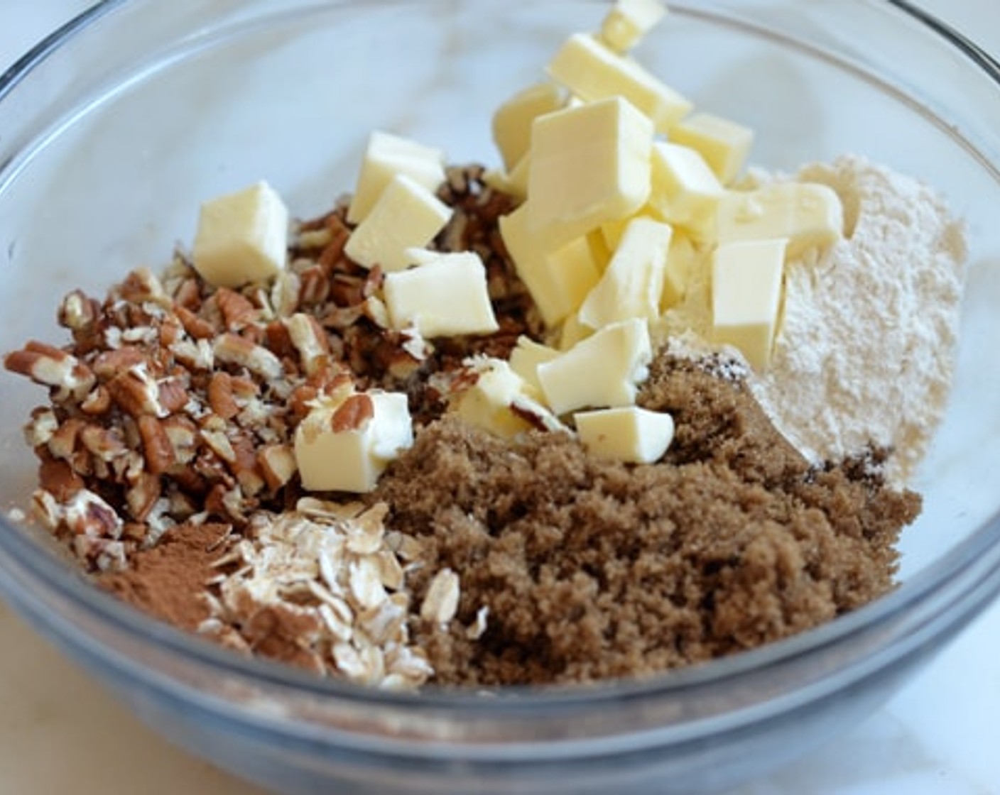 step 9 Meanwhile combine Brown Sugar (110 g), Old Fashioned Rolled Oats (2 Tbsp), Chopped Pecans (55 g), All-Purpose Flour (4 Tbsp), Unsalted Butter (4 Tbsp), Ground Cinnamon (1/2 tsp), and Ground Nutmeg (1/4 tsp) in a bowl.