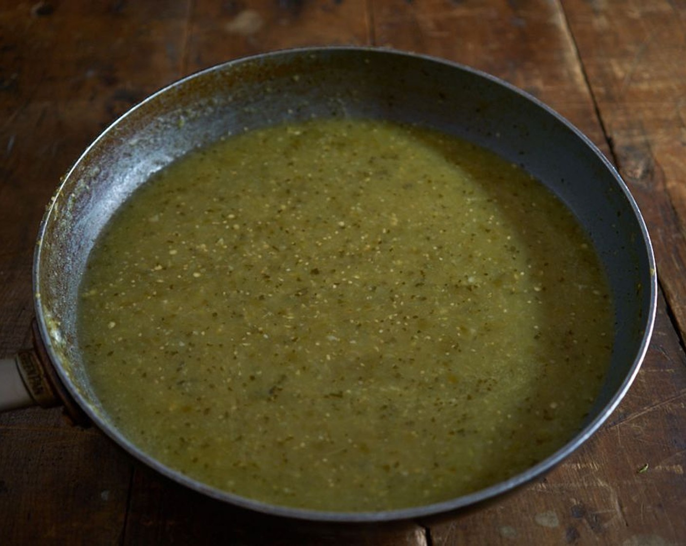 step 8 Once the Vegetable Oil (1 Tbsp) is hot, add 2 1/2 cups of the tomatillo mixture to the pan to fry it. Stir frequently for about 5 minutes, until the cilantro darkens and the sauce thickens a bit. Add the Chicken Stock (2 1/4 cups) and bring to a boil. Reduce heat and simmer until the sauce thickens enough to coat the back of a spoon.