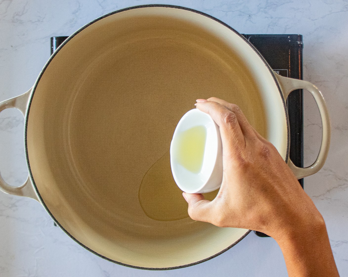 step 1 In a Dutch oven or deep skillet, over medium-high heat, add Olive Oil (2 Tbsp). Once the oil is hot, add the Garlic (1 tsp) and cook for about 30 seconds while stirring constantly.