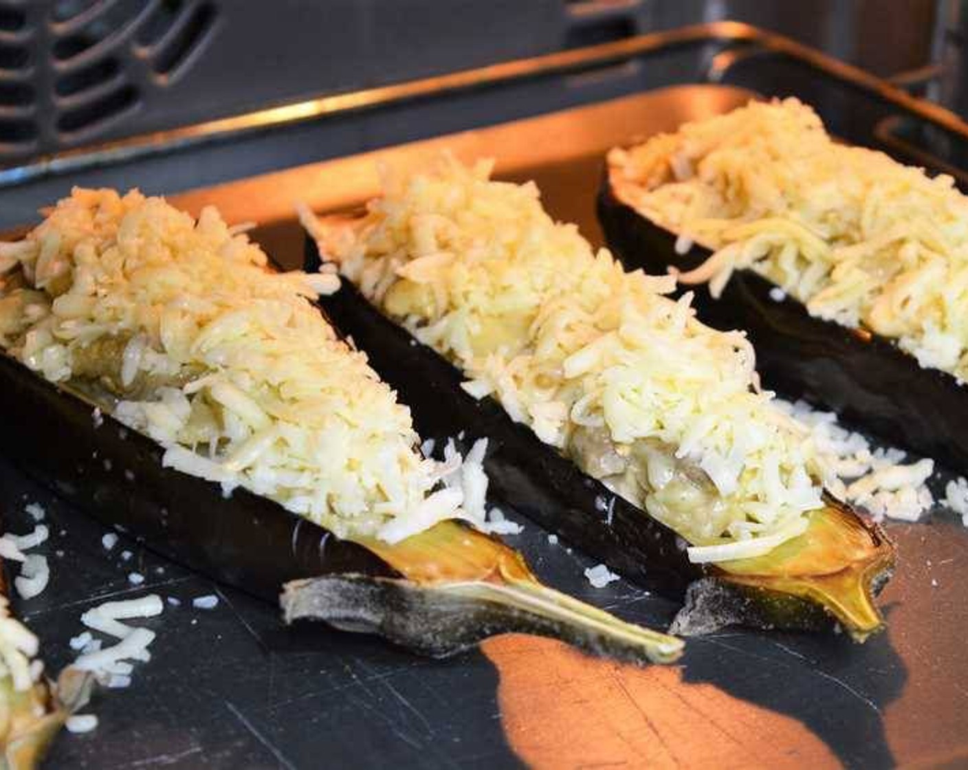 step 12 Turn the oven to broil at 400 degrees F (200 degrees C) and place the stuffed eggplants in.