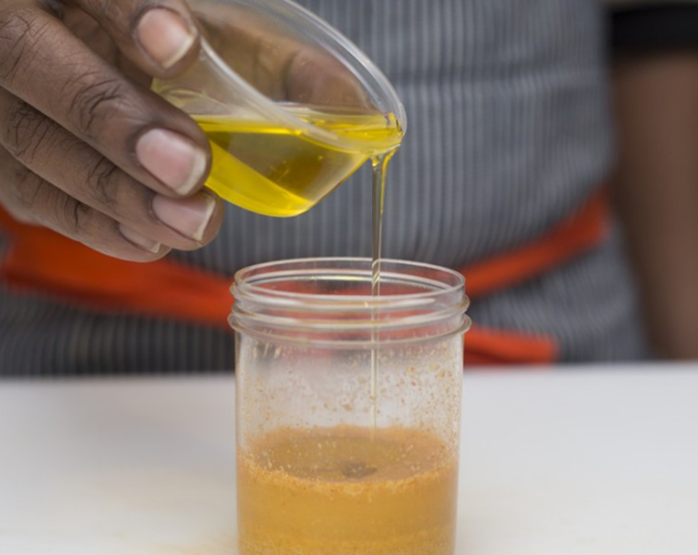 step 3 Make the dressing: To the Apple Cider Vinegar (to taste) jar add Olive Oil (2 Tbsp), Water (1 Tbsp), Nutritional Yeast (to taste), Ground Turmeric (to taste), Spicy Brown Mustard (to taste), Salt (1/2 tsp). Cover tightly, and shake well to thoroughly combine.