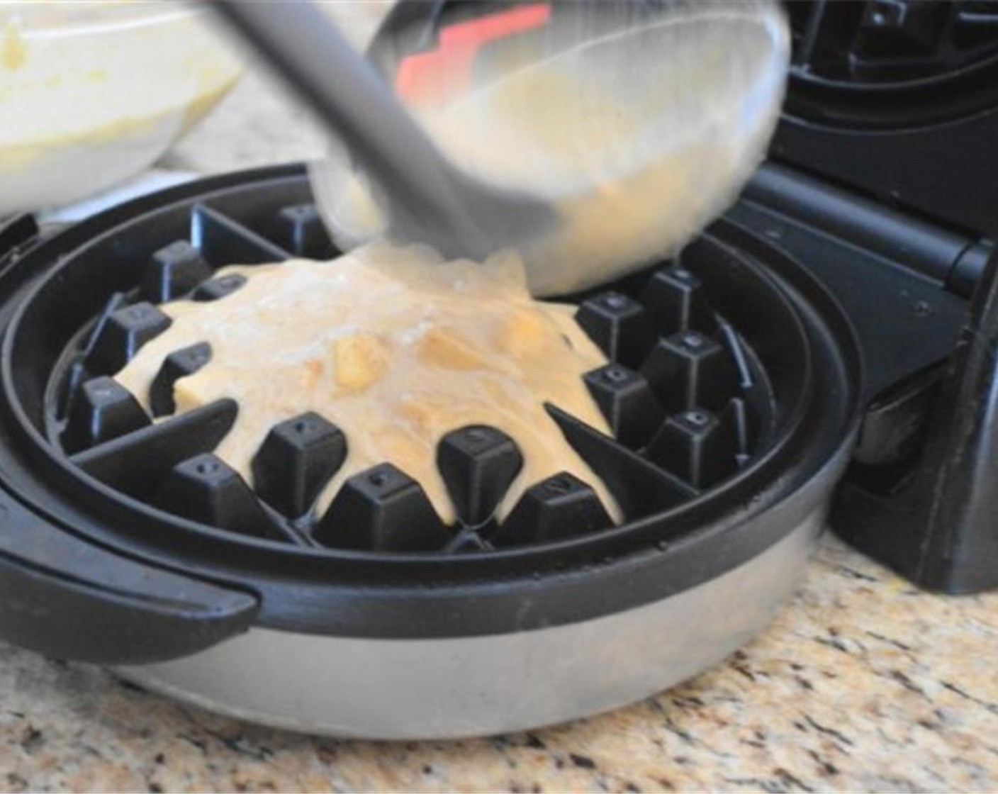 step 6 Pour about a quarter of the batter into the bottom half of the hot iron. There should be just enough to cover that bottom half of the iron. Close the iron and let the waffle cook for 5 minutes. Be sure to check the instructions of your specific waffle iron for best results.