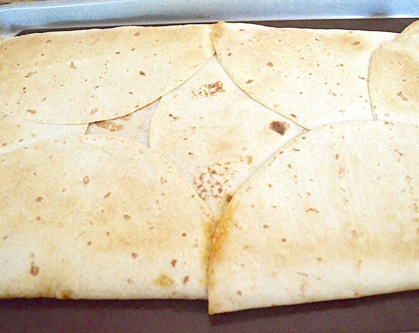 step 11 Then, take it out and remove the heavy pan, top sheet pan and parchment and return the crunch wrap to the oven for another 6-8 minutes to really let it crisp up on top.