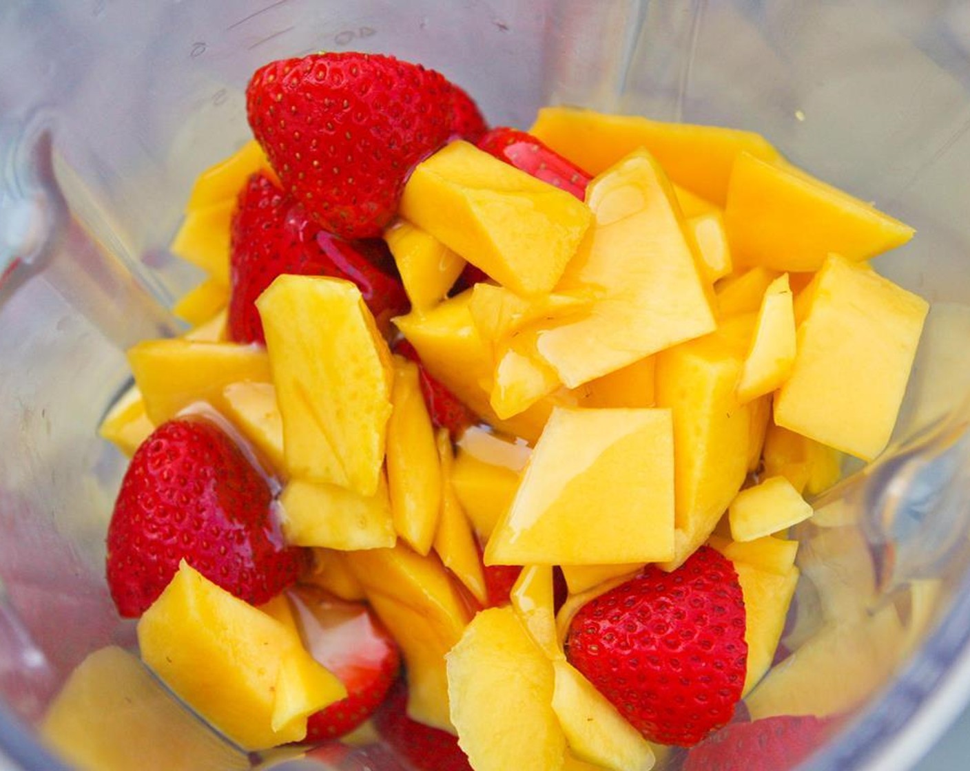 step 3 Place the mango, strawberries, and Honey (to taste) into a blender or food processor and pureé until smooth.