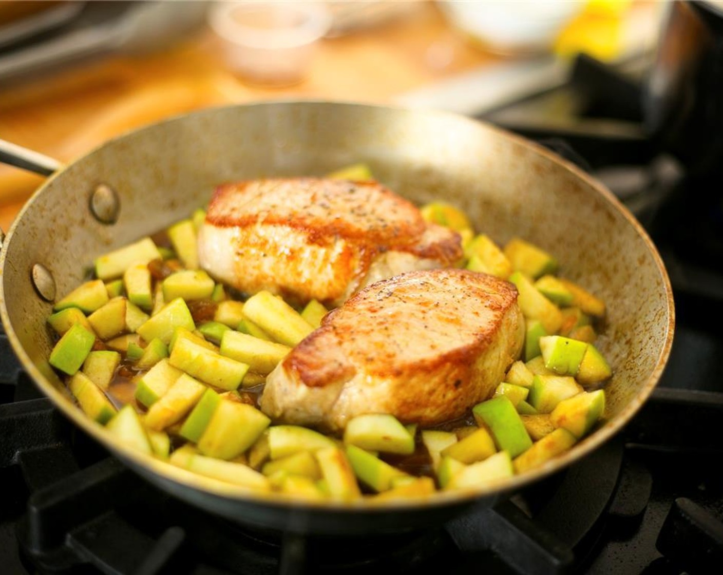 step 9 Lower heat to medium low, add Apricot Preserves (1/3 cup), granny smith apple, and Balsamic Vinegar (2 tsp). Stir and cook for four minutes until pork is still pink in the middle. Remove from heat and whisk in two tablespoons of Butter (2 Tbsp) Keep warm.