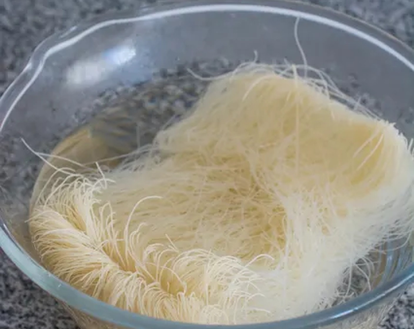 step 1 Soak the Vermicelli Noodles (8 oz) in warm water for about 30 minutes. Then drain them, cover the bowl with plastic wrap, and set them aside.