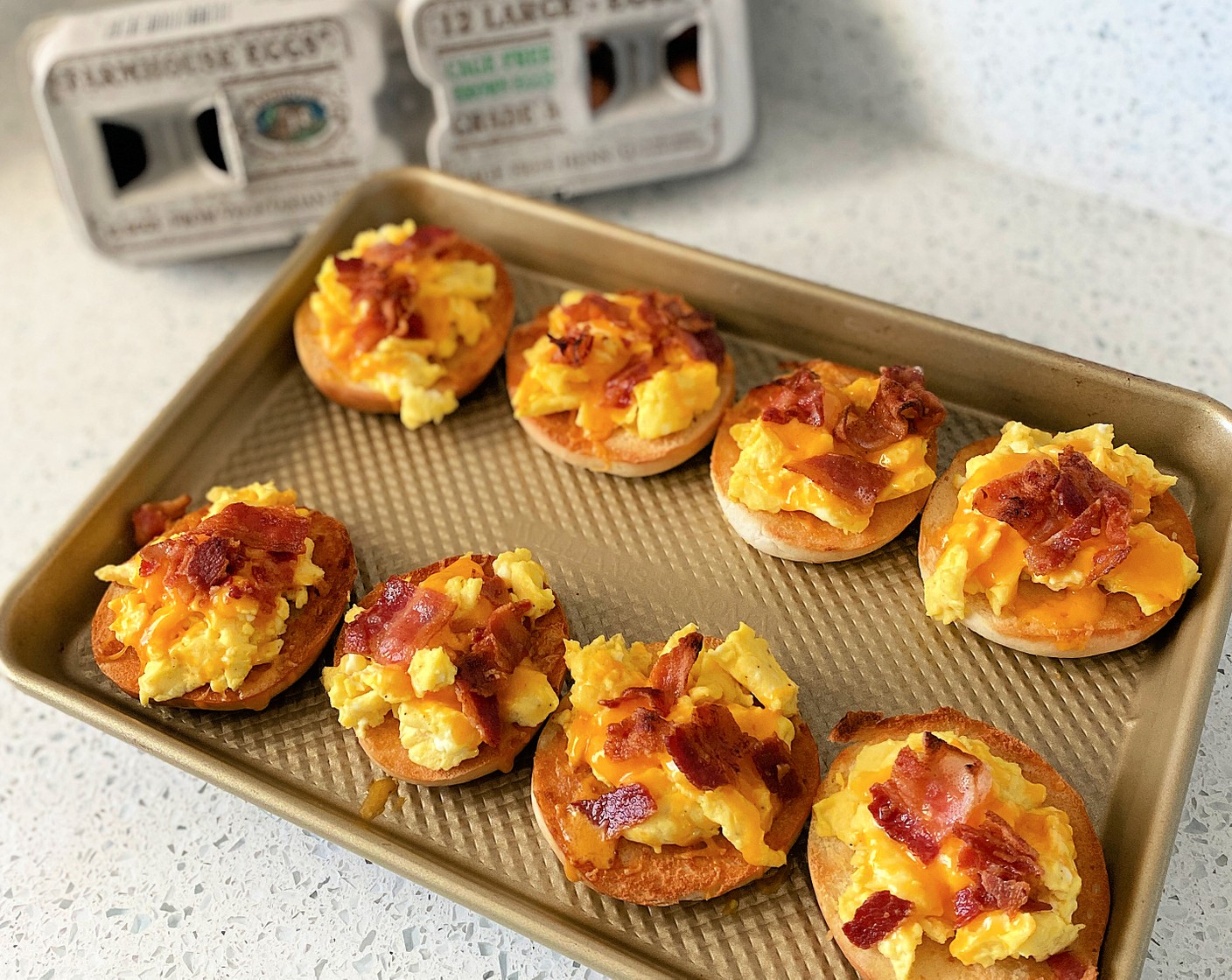 step 5 Place bagels under the broiler for a minute or two to melt the cheese and rewarm the eggs. Watch them closely!