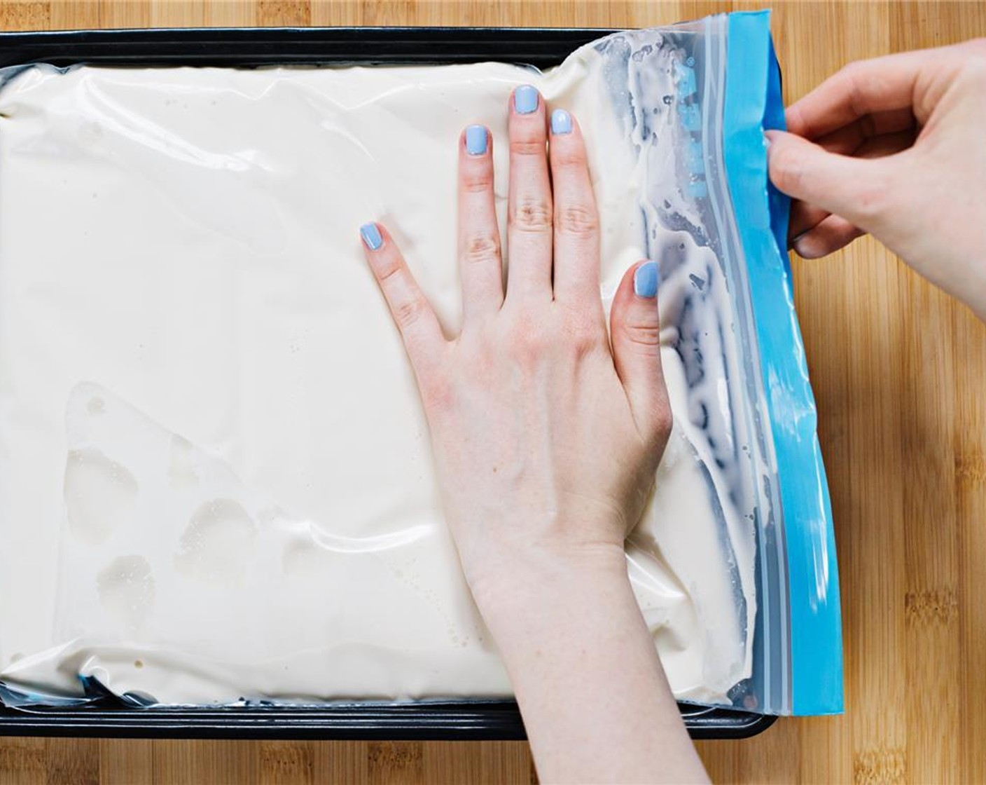 step 3 Lay bag flat onto a baking sheet, and press to remove as much air as possible.
