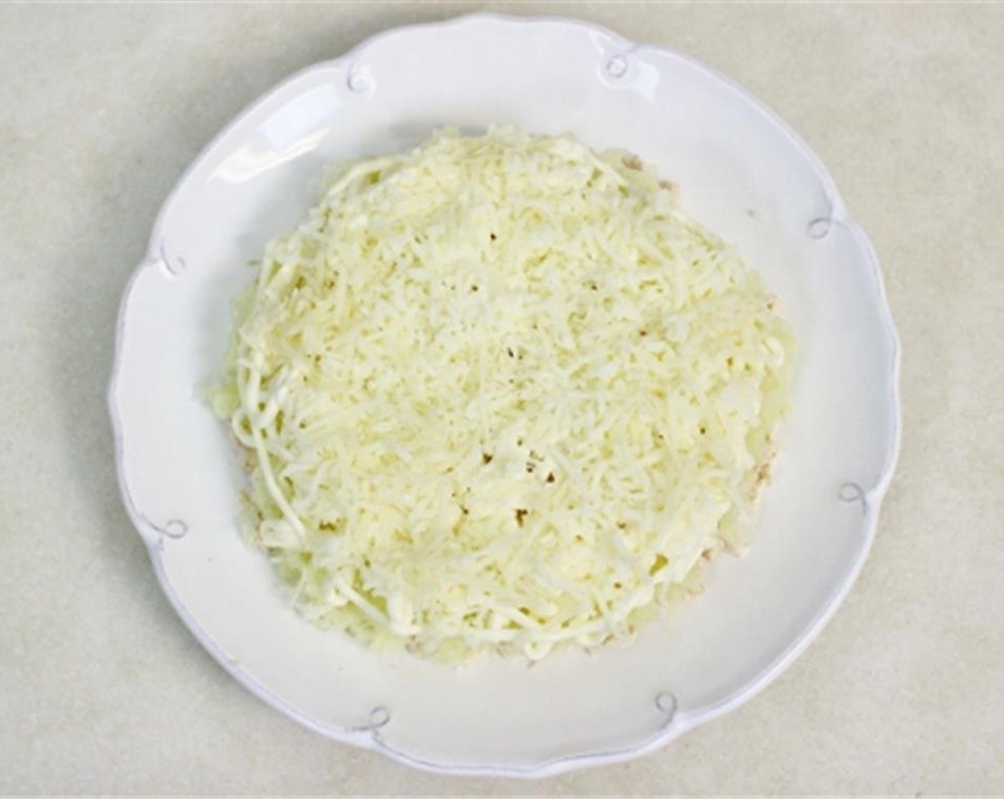 step 11 Spread the finely grated Mozzarella Cheese (1/2 cup) on top of the potatoes. You might need less than 1/4 cup of cheese on each salad, you need just enough to cover the potatoes in a thin layer.
