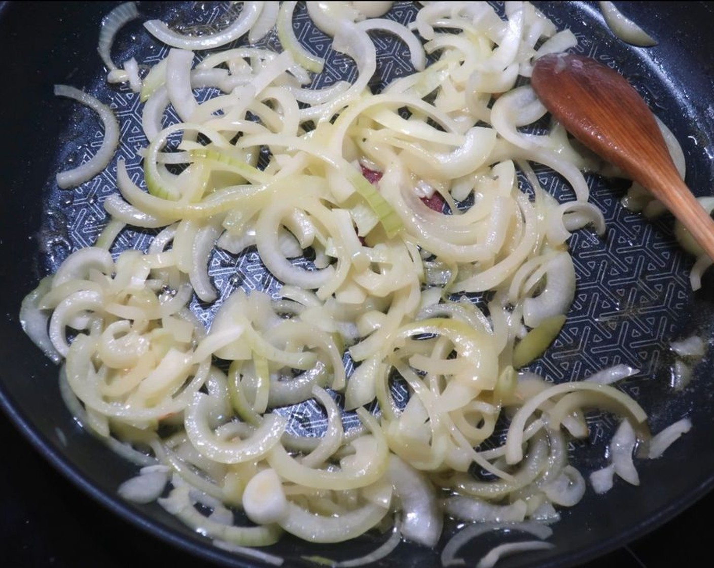 step 3 Into a pan, add Ghee (1/4 cup). Once warm, sauté White Onion (1).