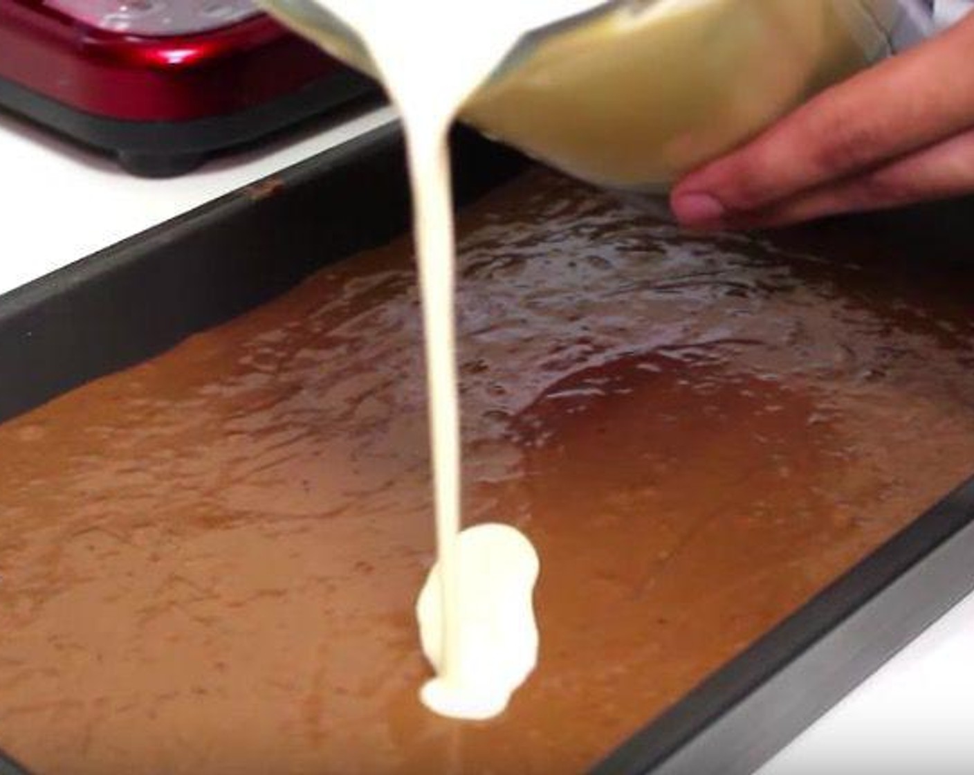 step 3 Pour Eggs (5), Evaporated Milk (12 fl oz), Sweetened Condensed Milk (1 1/3 cups) and Vanilla Extract (1 tsp) into a blender and blend it together. Pour this mixture on top of the batter in the pan. Cover with foil.
