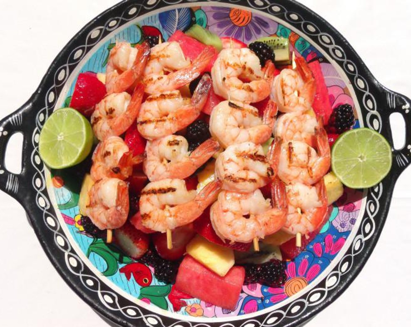 Grilled Shrimp Brochettes on Honey and Rum Macerated Fruits