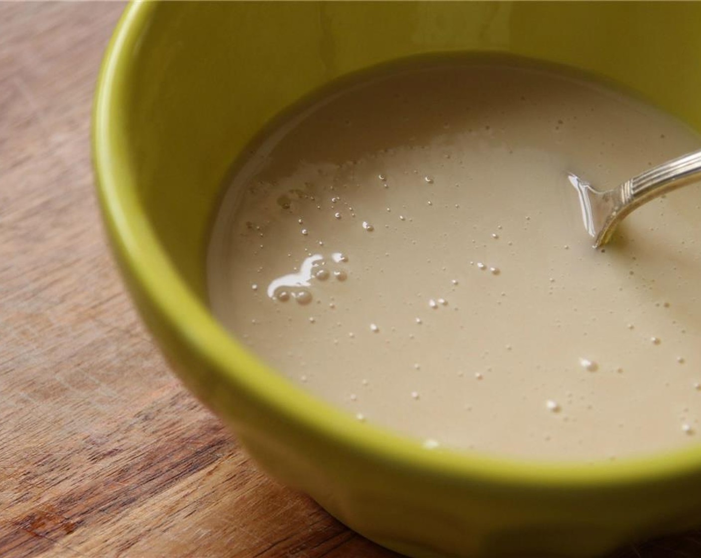 step 8 Stir the glaze ingredients Powdered Confectioners Sugar (1 cup), Maple Syrup (1/4 cup), and Unsweetened Almond Milk (1 tsp) with a fork until fully combined. Add more milk if a thinner consistency is desired.