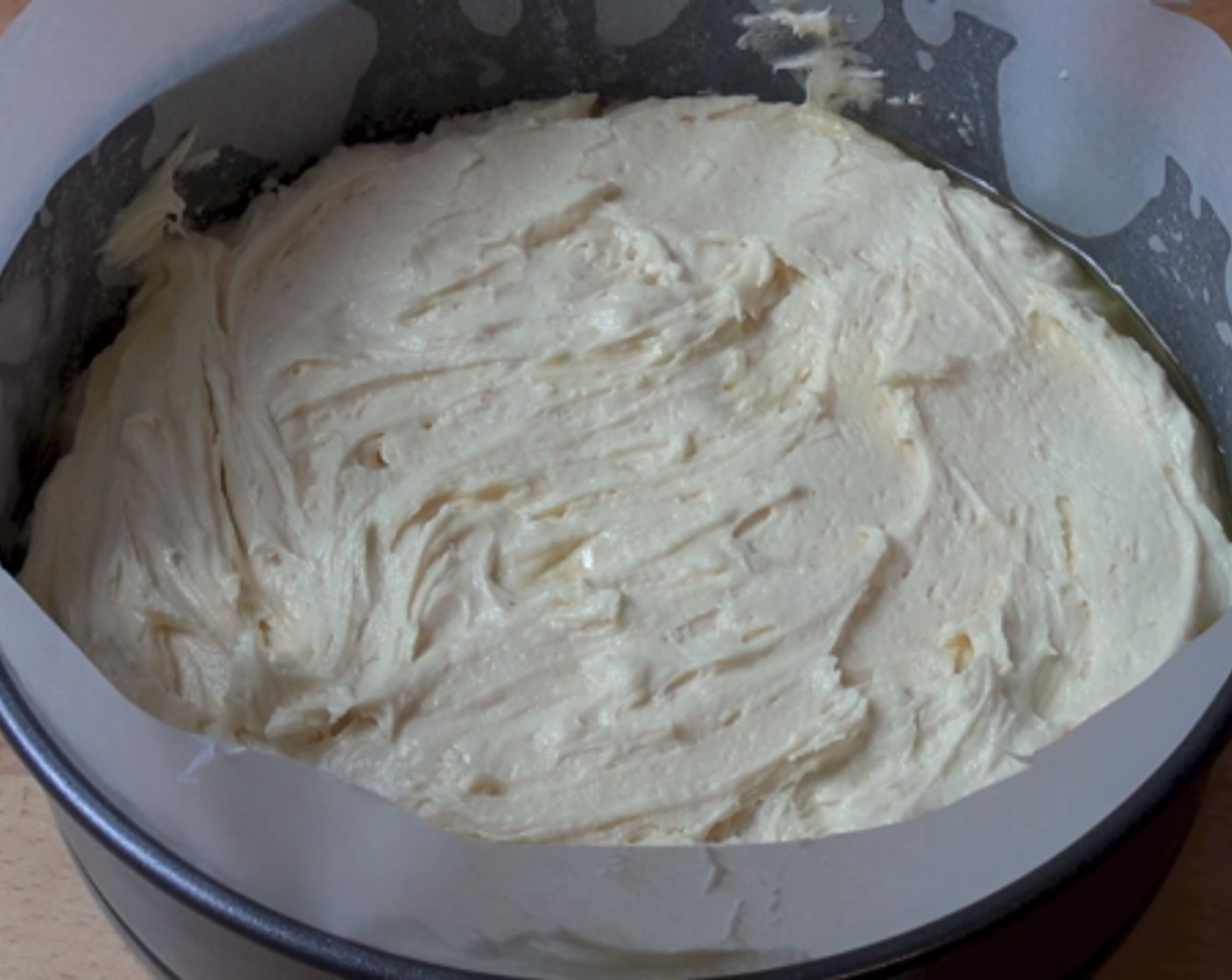 step 6 Gently spoon the cake batter over the pineapple rings and even out the surface using a spatula. Cook at 180 degrees C (350 degrees F) for 55 minutes or until a skewer inserted into the center of the cake comes out clean.