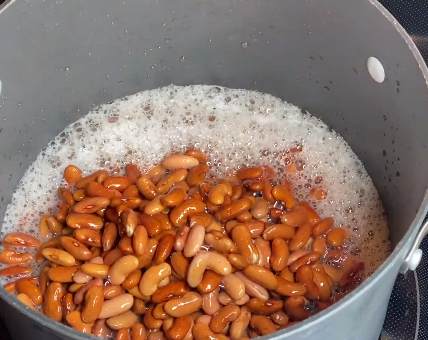 step 3 The next day, place the beans and the water in a large pot and add more Water (as needed) if necessary to cover the beans. Bring to a boil over high heat.