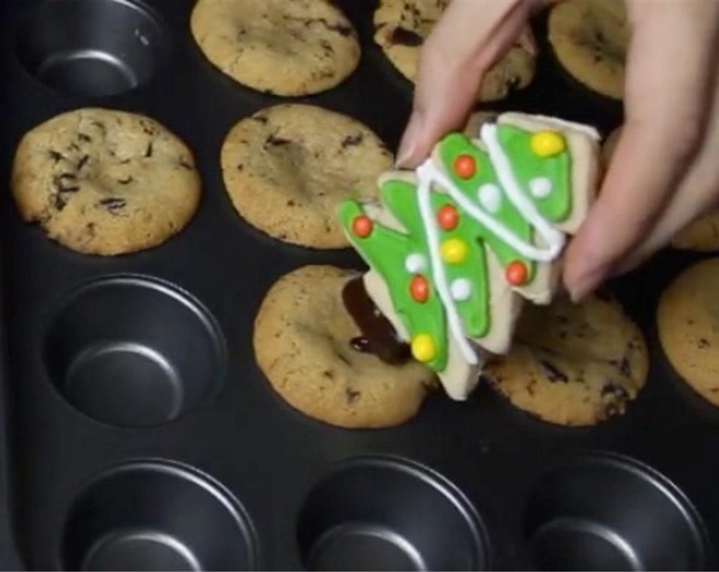 step 25 Once it’s out from the oven, immediately coat the end of every Christmas tree with melted chocolate and squash it into the center of every pot cookies.