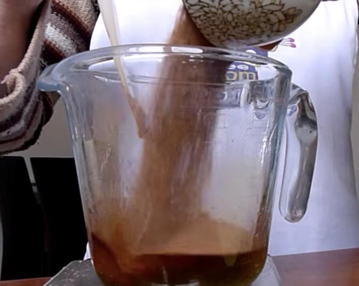 step 2 Scrape the seeds out of the Vanilla Bean Pod (1/2). Add them to the Cacao Powder (1/3 cup) and Rice Syrup (2 tsp) and stir well to combine.